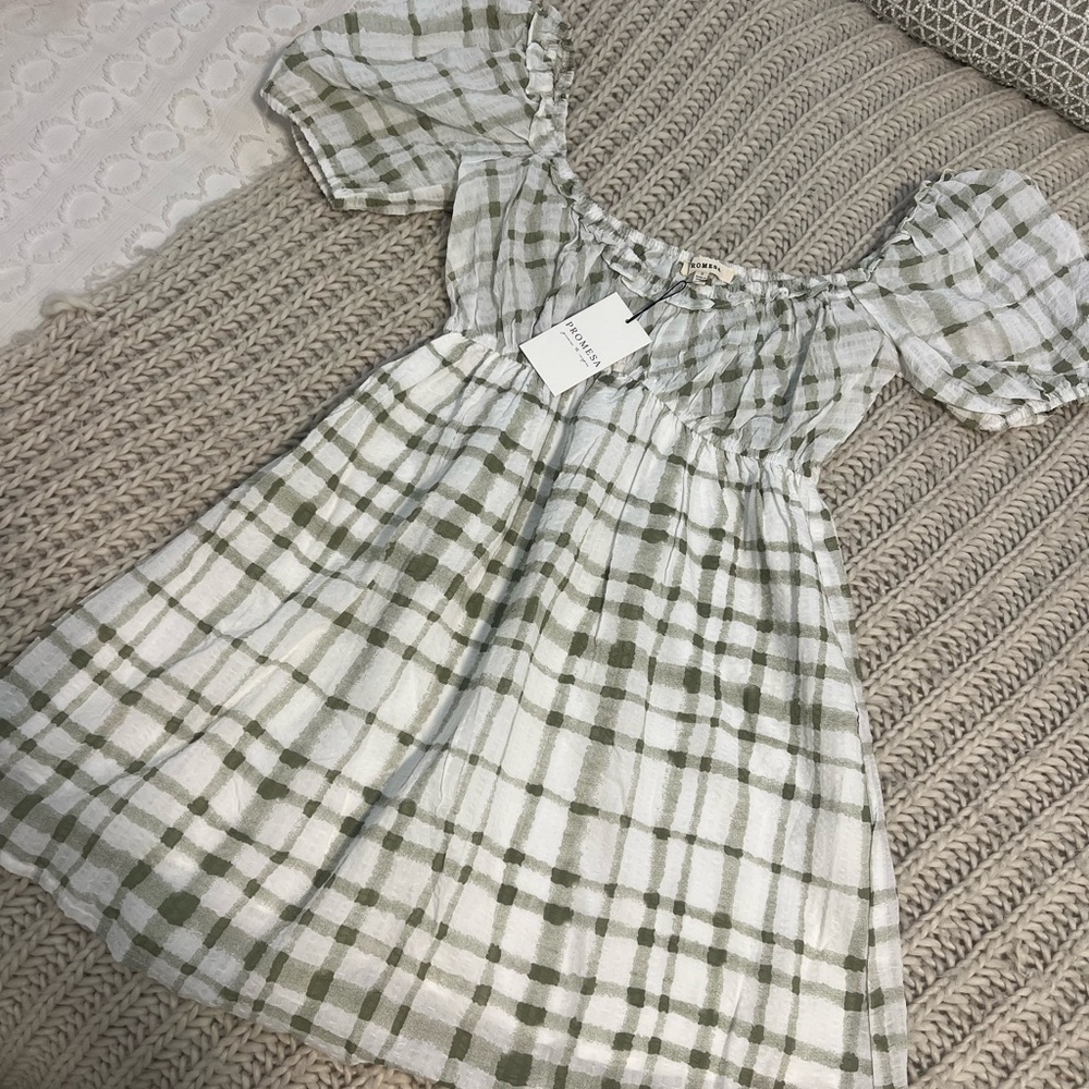 Short white and green plaid dress can be worn off the shoulder if wanted.